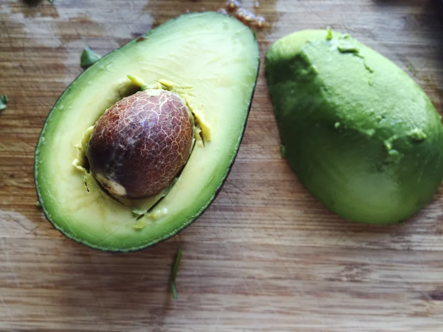 Fresh avocado on a rustic wooden surface